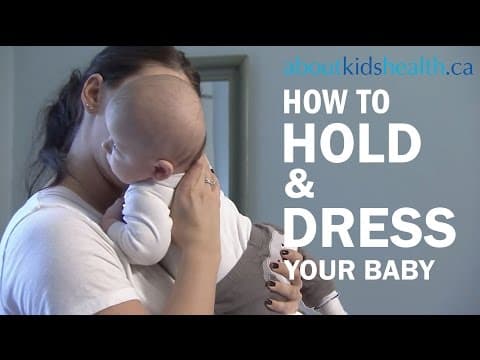 how to hold and dress your newborn baby
