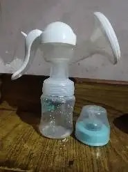 Manual Breast Pump For Feeding Mothers | Anti Colic & BPA Free | Compact & Lightweight | Easy to hold | Easy to Clean | With Bottle (150 ml)