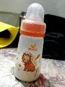 2-in-1 Baby Feeding Bottle | BPA Free with Anti-Colic Nipple & Spoon | Easy Flow Neck Design - Lion & Giraffe 125ml & 250ml