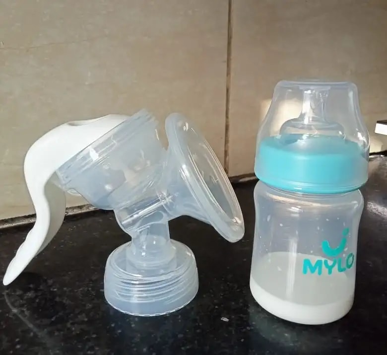 Manual Breast Pump For Feeding Mothers | Anti Colic & BPA Free | Compact & Lightweight | Easy to hold | Easy to Clean | With Bottle (150 ml)