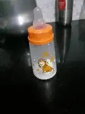 2-in-1 Baby Feeding Bottle | BPA Free with Anti-Colic Nipple & Spoon | Easy Flow Neck Design - Lion & Giraffe 125ml & 250ml